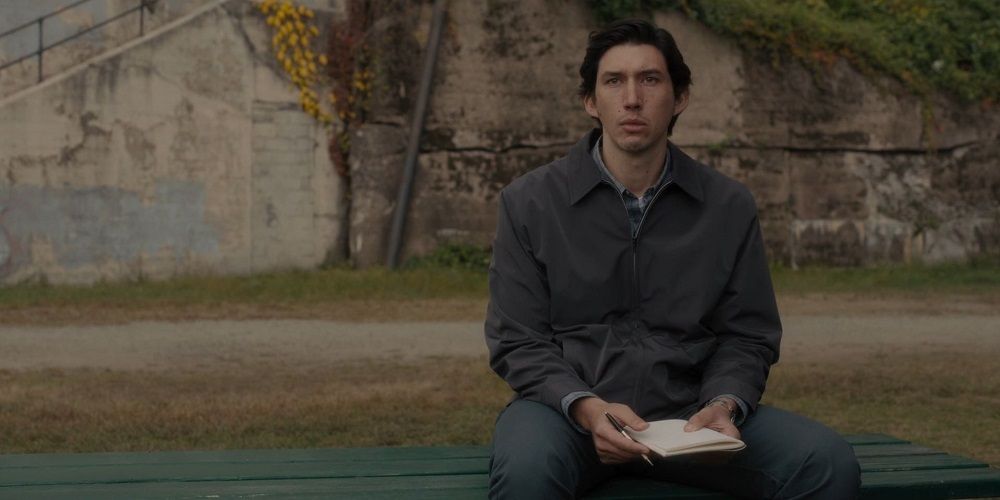 Adam Driver as Paterson, holding pad and sitting on bench