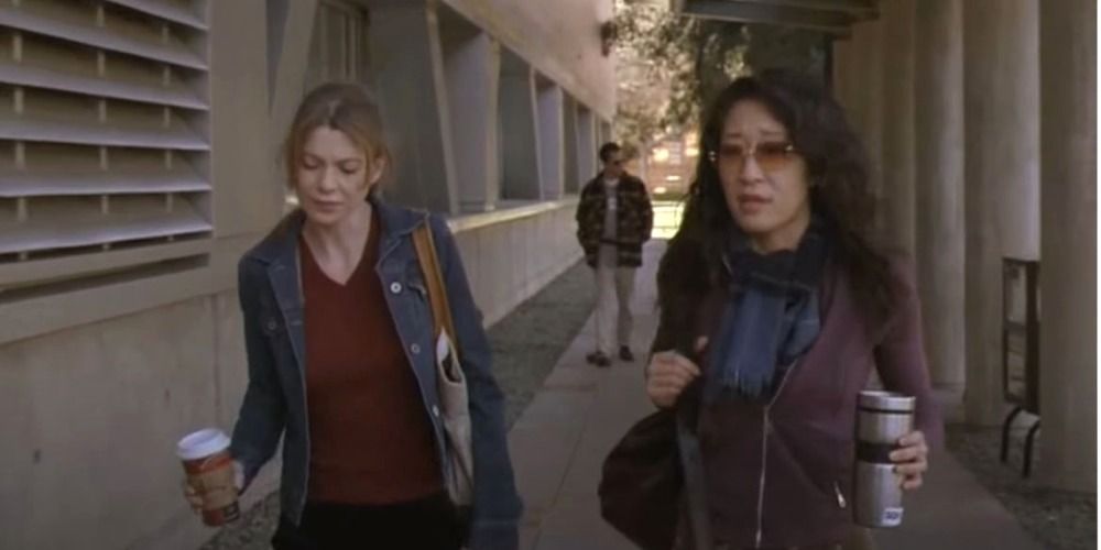 Meredith and Cristina arriving at the hospital together with coffees.
