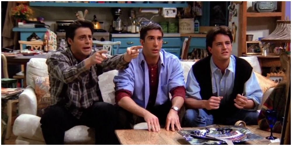 Friends' Ross, Chandler and Joey playing Pictionary on the sofa
