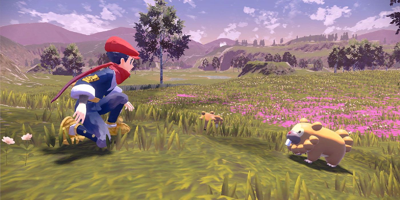 Pokémon Legends: personagem masculino padrão de Arceus ajoelhado em um campo ao lado de um Bidoof.