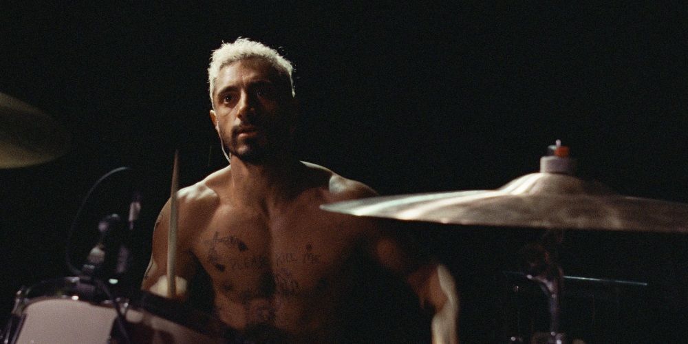 Riz Ahmed playing drums in a still from Sound of Metal.