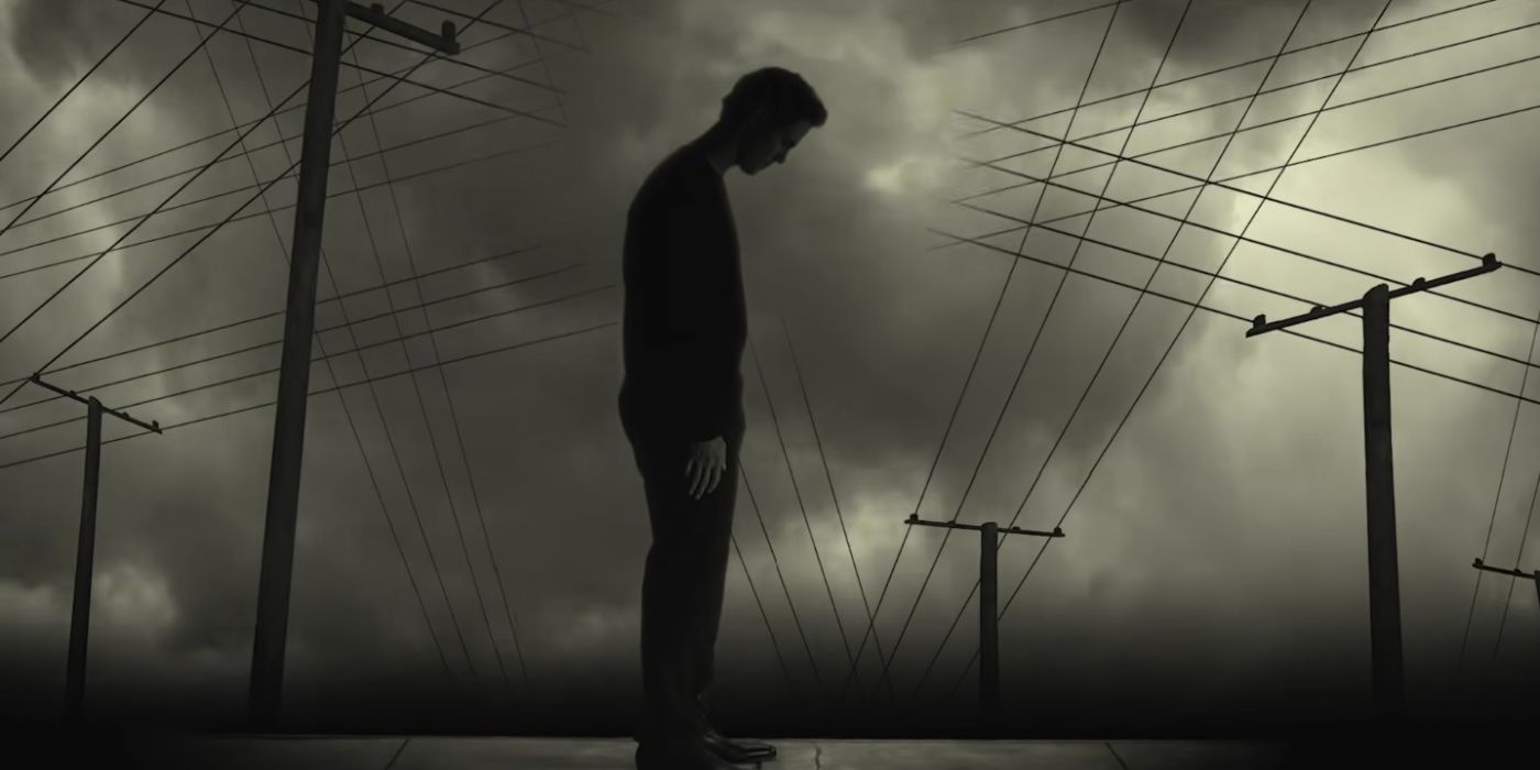 still of a man looking down in from of telephone wires from josh grobans river music video