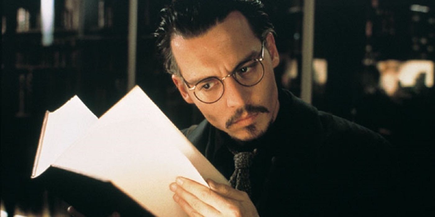 Johnny Depp with a book in The Ninth Gate.