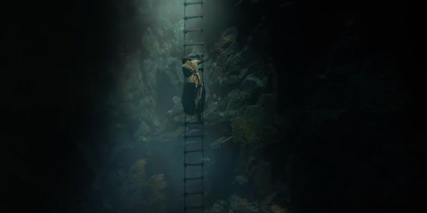 A character climbing a rope ladder in The Underground Railroad