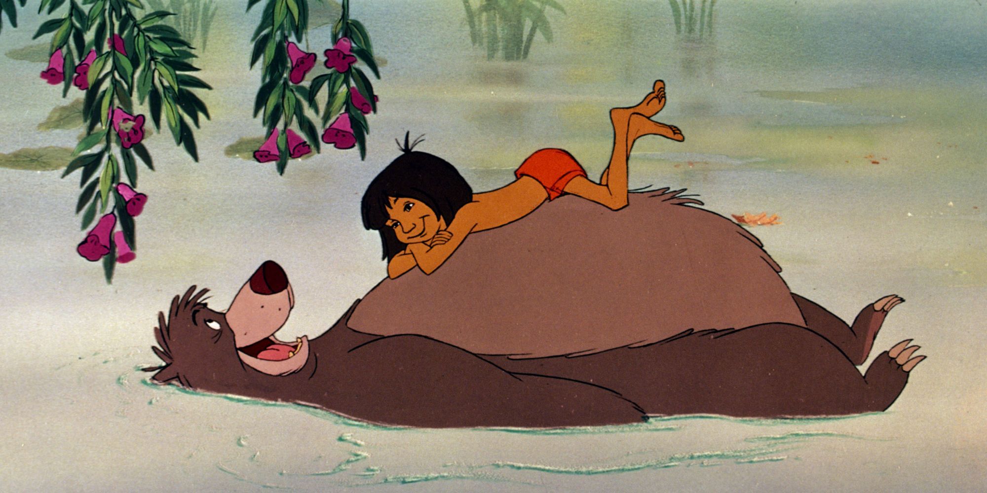 Mowgli lays on Baloo's stomach
