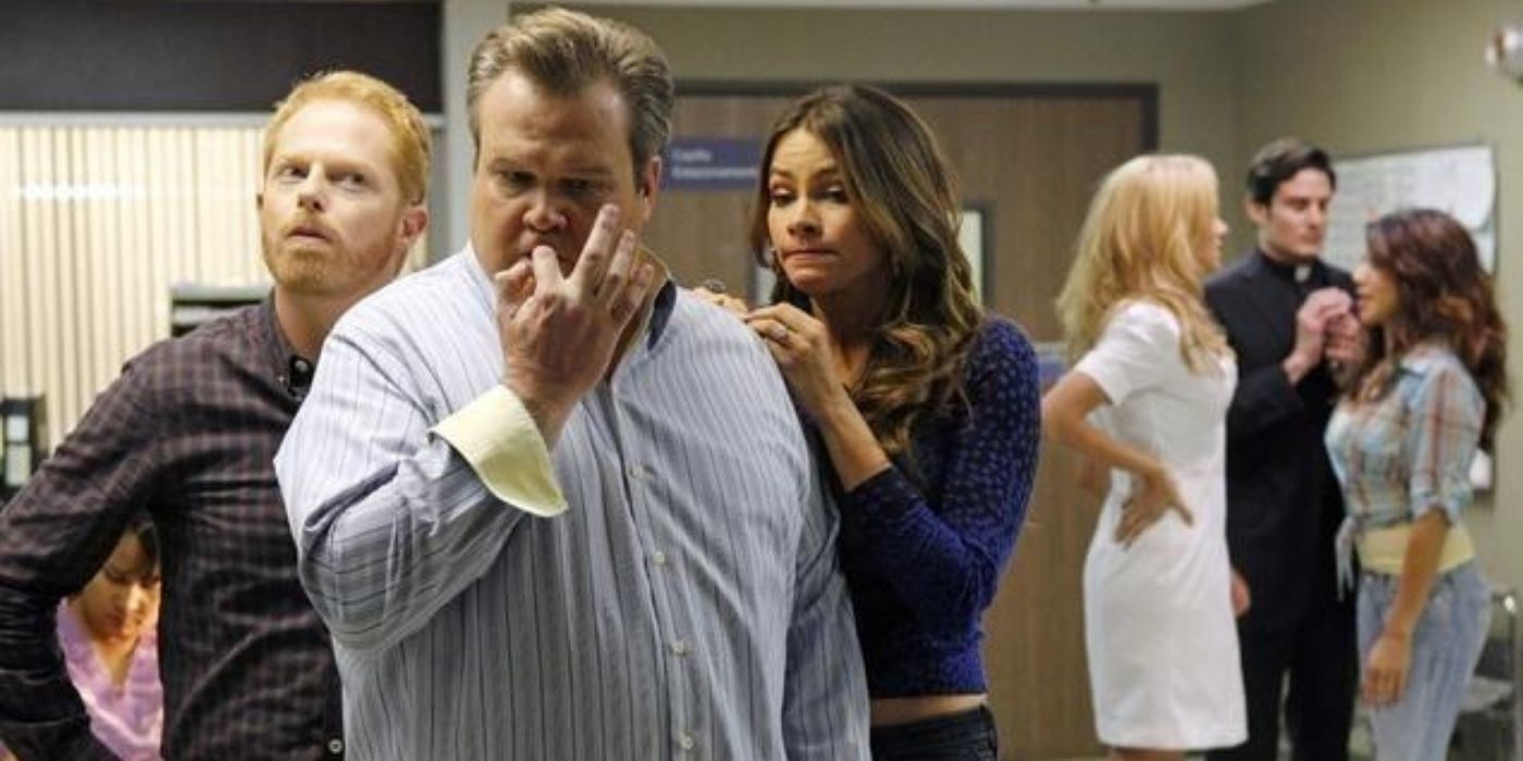 Gloria, Cam, and Mitch wait in the hospital lobby on Modern Family