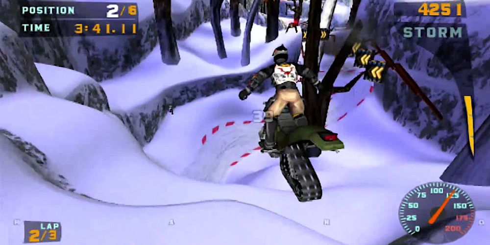 A player jumps over a snowy mountain in Sled Storm
