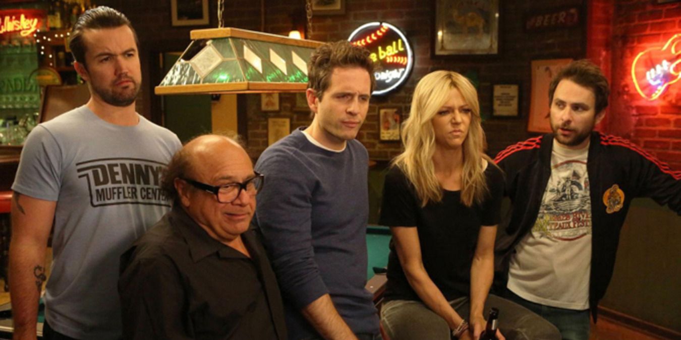 Scene from It’s Always Sunny in Philadelphia with the group leaning against the pool table 