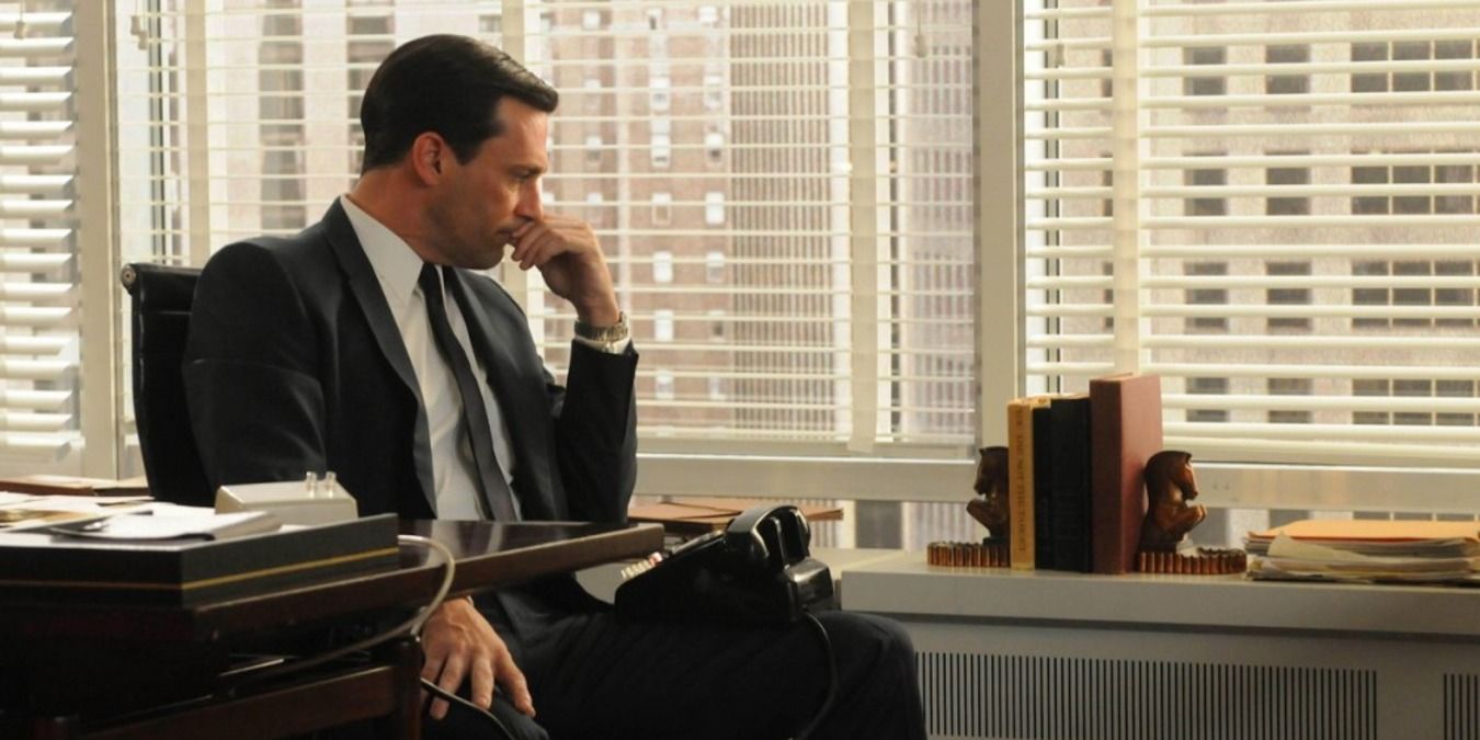 Mad Men scene with Don Draper sitting at his desk, looking pensive.