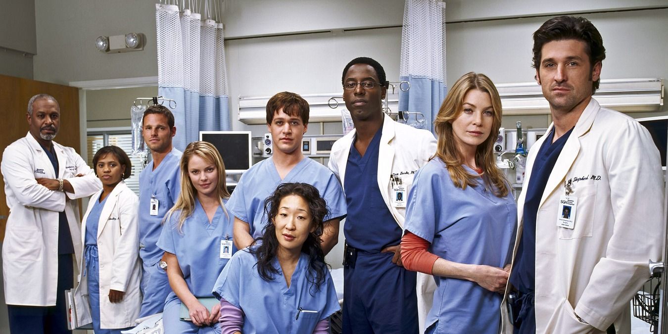 Scene from Grey’s Anatomy with the cast standing in front of the care room