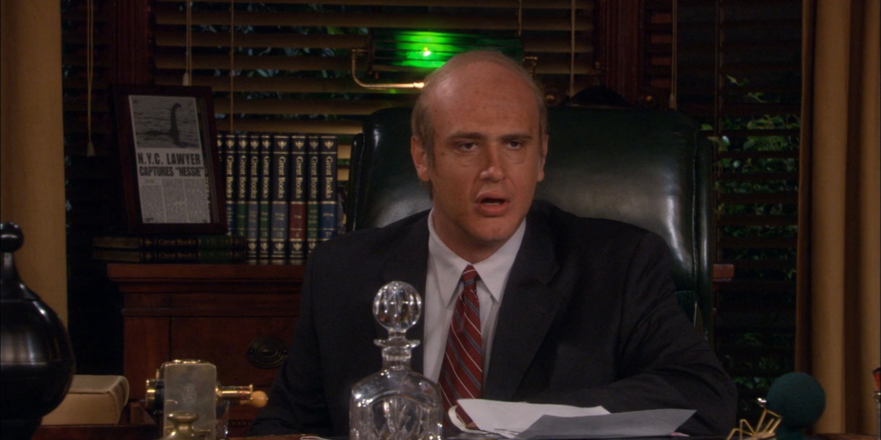Old Marshall sitting behind his desk in How I Met Your Mother