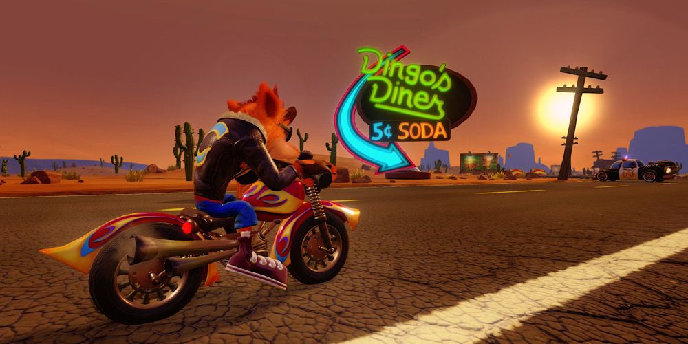 Crash rides past Dingo’s Diner on a motorbike in Warped