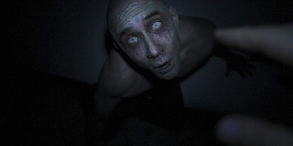 A terrified Derek looking into the camera in Afflicted