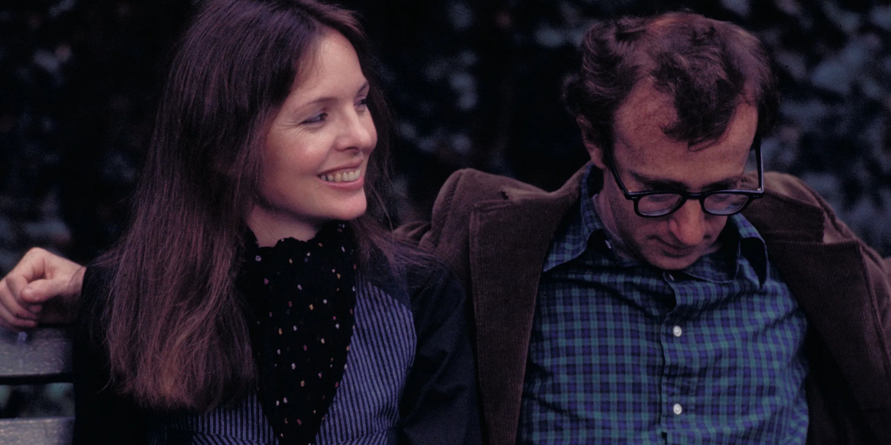 Diane Keaton and Woody Allen laughing on bench in Annie Hall