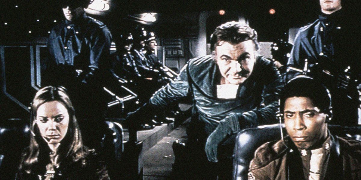 Original crew of Battlestar Galactica behind the cockpit