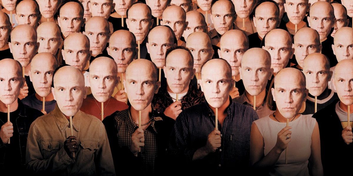 Promo image of the crowd with Malkovich masks for Being John Malkovich