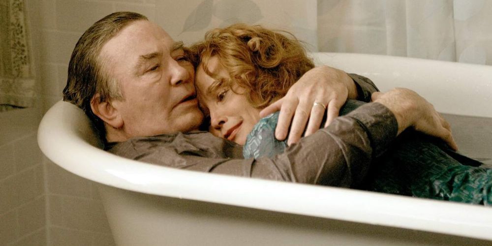 Edward and Sandra Bloom, played by Albert Finney and Jessica Lange, embracing in a full bathtub in Big Fish