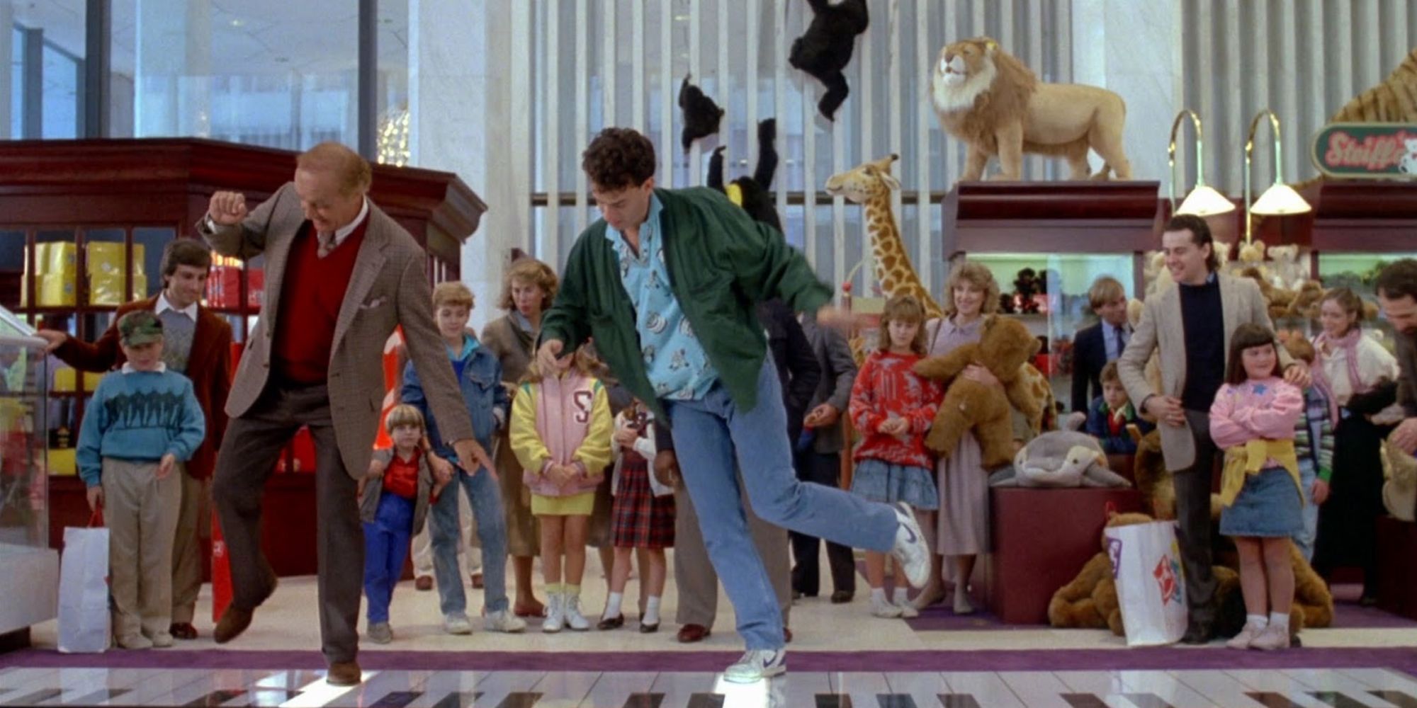 Tom Hanks and Robert Loggia dancing on the floor piano in Big