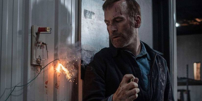 Bob Odenkirk lighting a fuse in Nobody