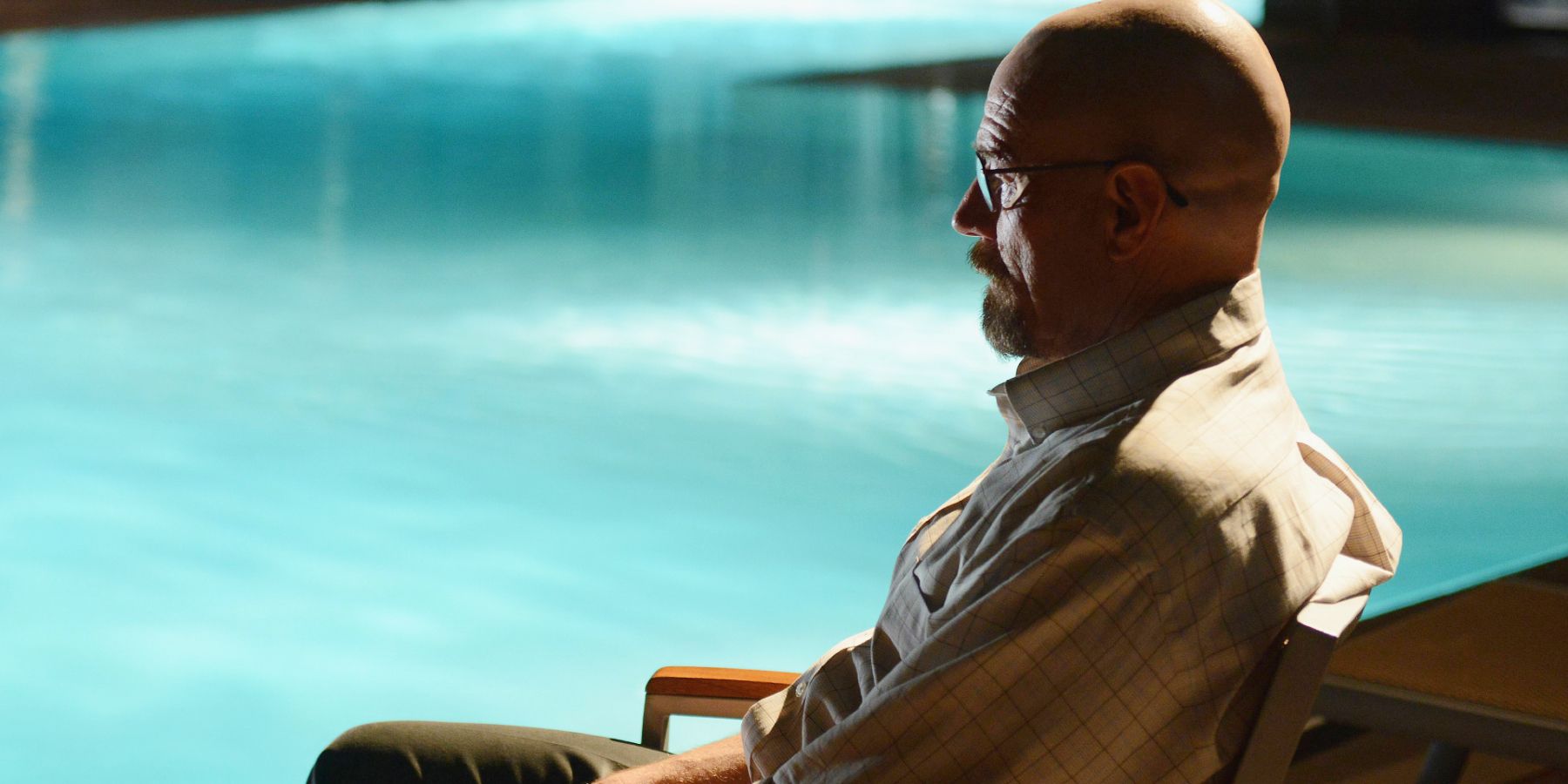 Walter White sitting by a pool in Breaking Bad.