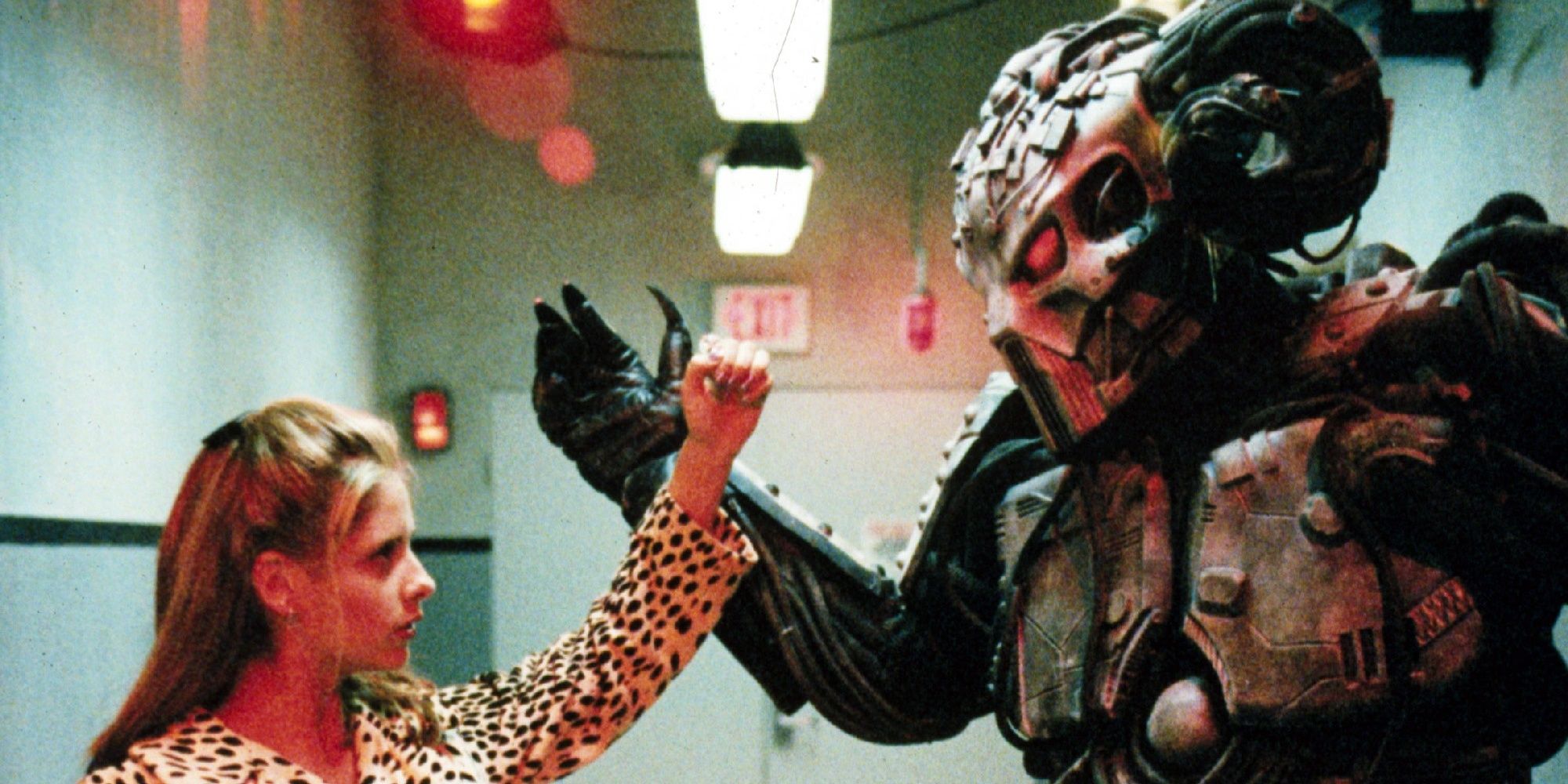 An image of Buffy fighting the Monster, which appears to be six feet tall and is wearing a ram-like mask. It has protective gear and red eyes too