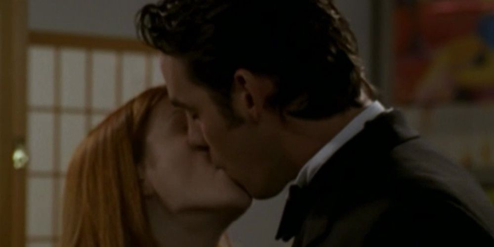 An image of Willow and Xander Kissing. They are dressed in their prom outfits, although Willow's outfit is not in the image