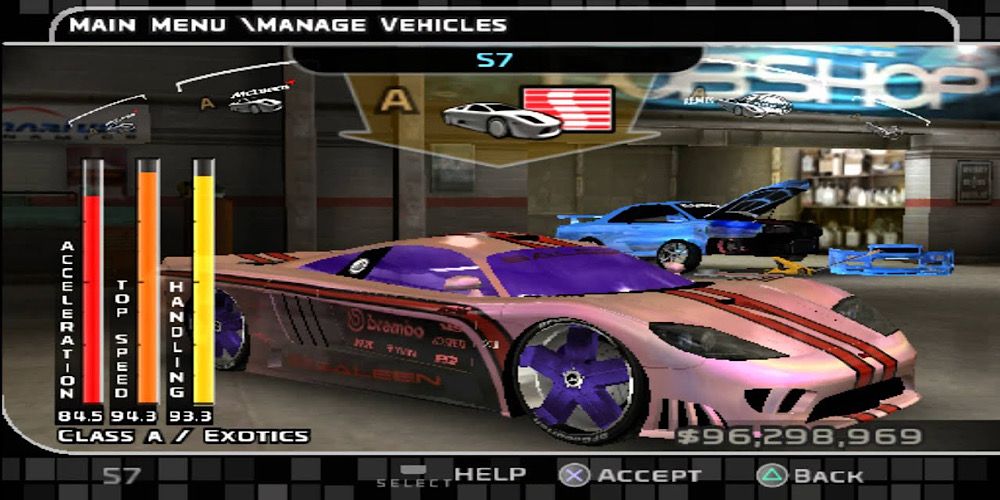 A pink and purple car is being worked on in the garage in Midnight Club III: DUB Edition Remix