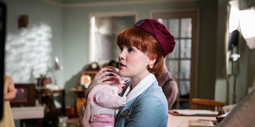 Nurse Patsy holds baby in Call the Midwife