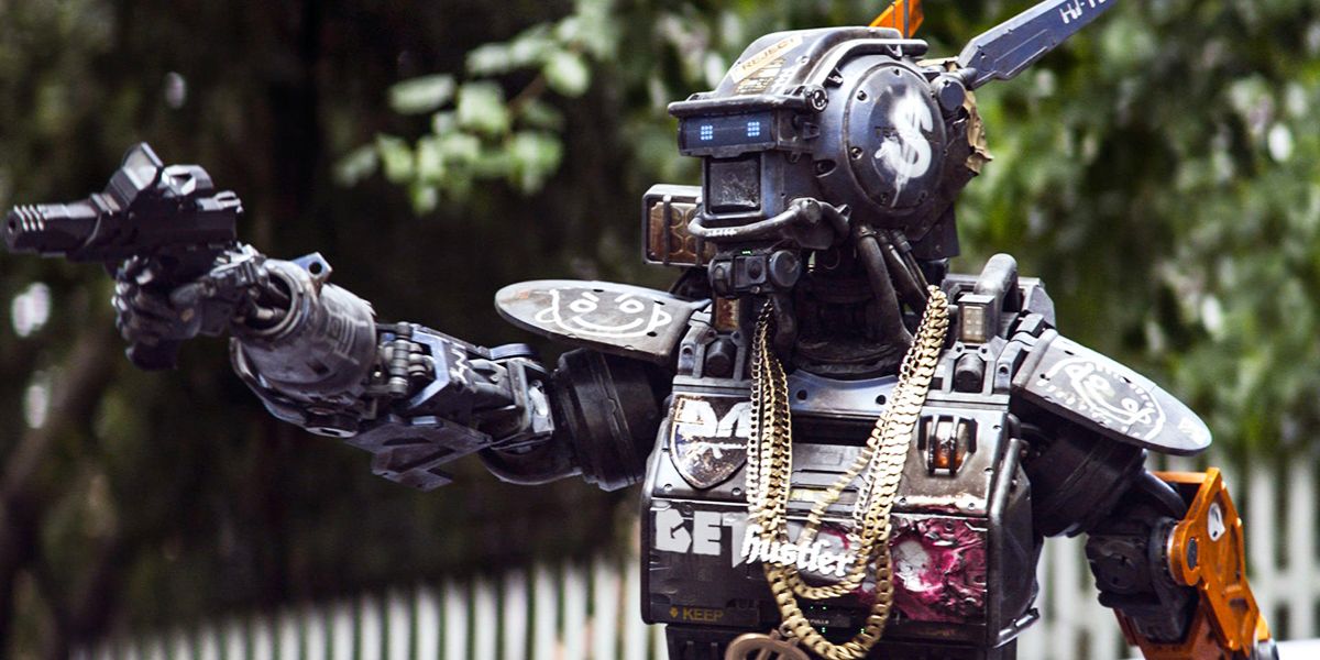 Robot Chappie pointing gun in movie of the same name