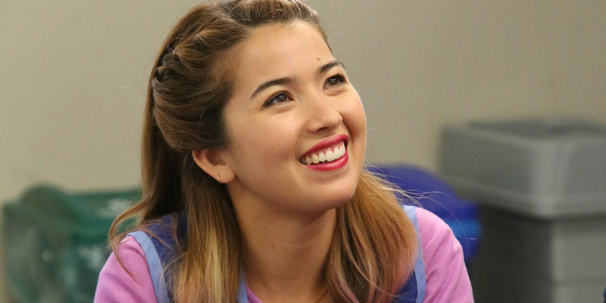 An image of Cheyenne Lee smiling in Superstore.