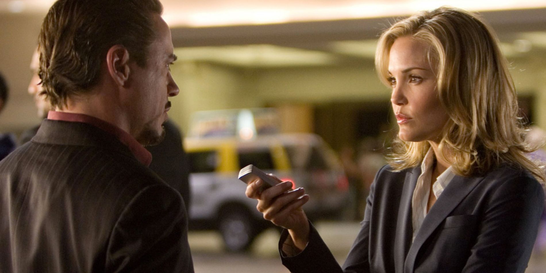 Christine Everhart holds out a recorder to Tony Stark to wait for his response in Iron Man
