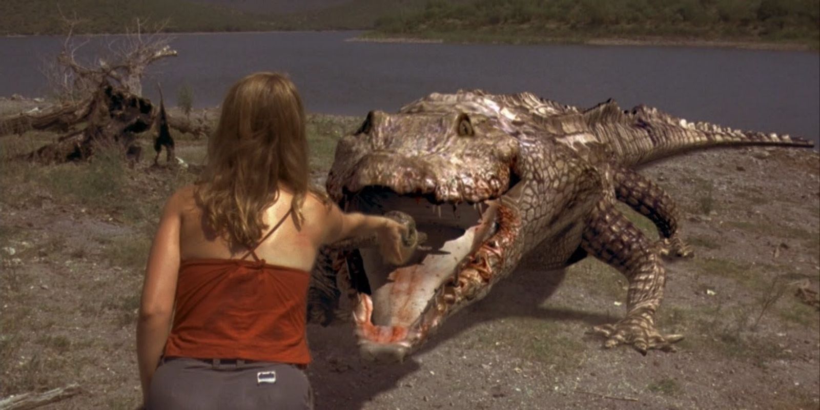 A woman returning a mother croc's stolen egg in Tobe Hooper's Crocodile