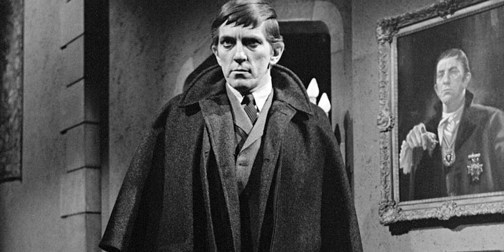 Barnabas standing next to a picture and looking at something off screen in Dark Shadows The Vampire Curse