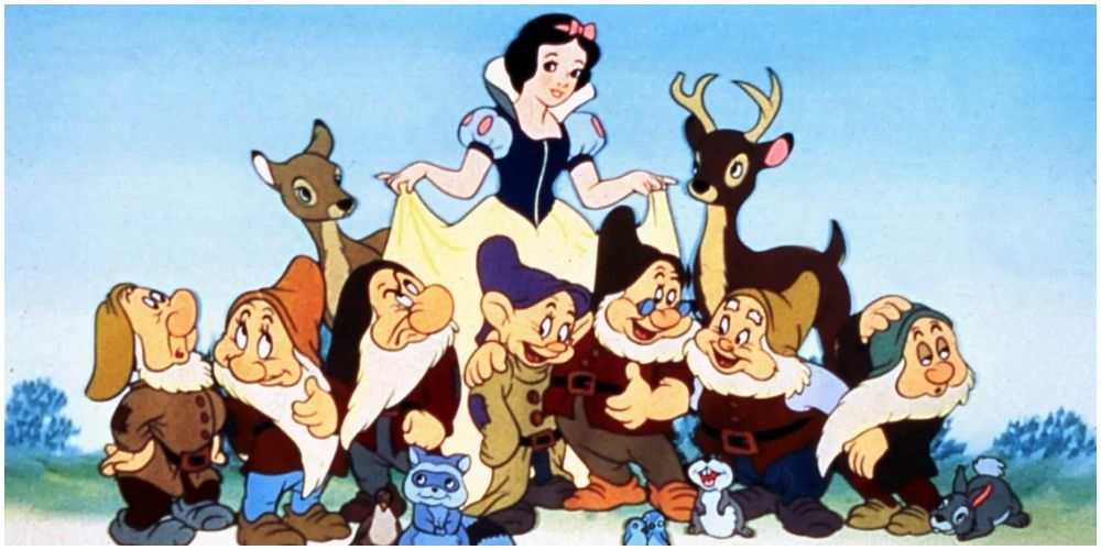 Snow White surrounded by the Seven Dwarfs and forest animals in Disney's Snow White