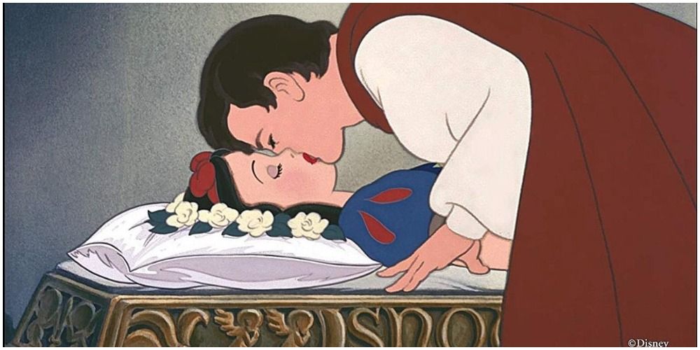 Prince leans over to kiss comatose Snow White in Disney's Snow White