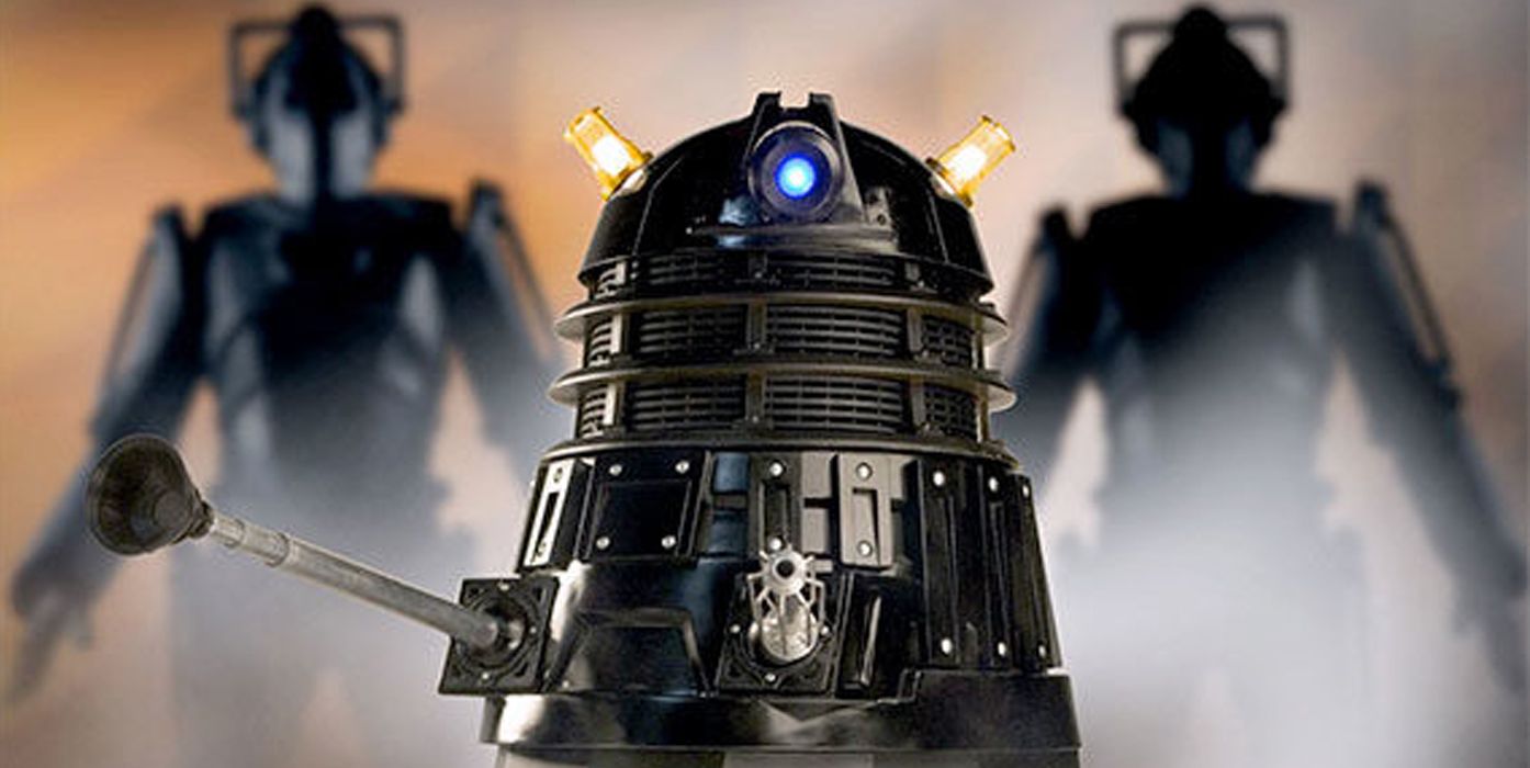 The Black Dalek Sec flanked by two Cybermen