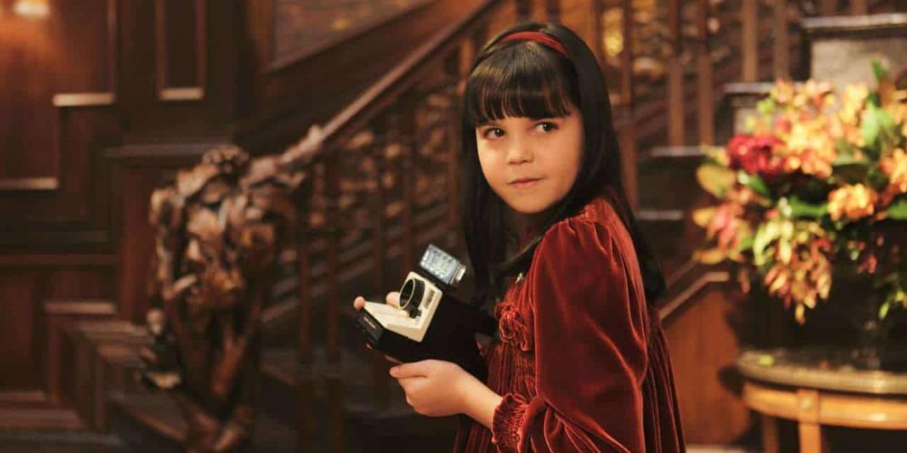 Sally holding a polaroid camera in Don't Be Afraid Of The Dark (2010)