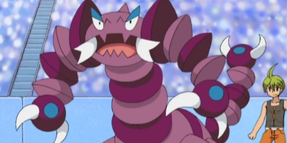 Elite Four Aaron uses Drapion in a battle scene from the Pokémon anime