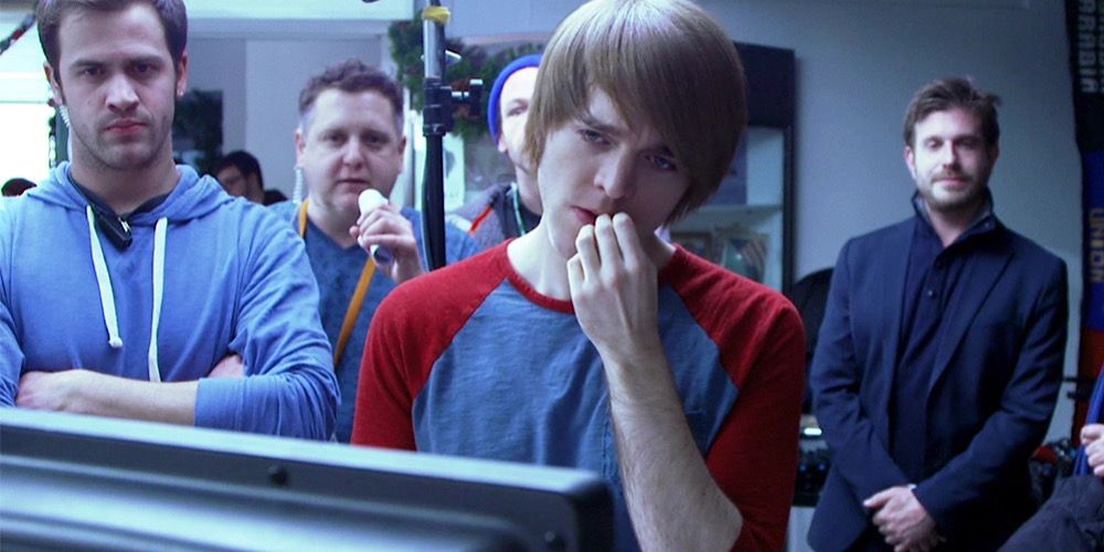 Shane Dawson looks at a monitor on set of Not Cool