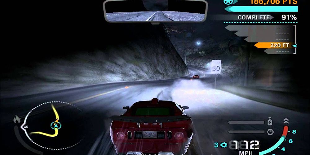 A car drifts down a mountain in pitch black in need For Speed Carbon