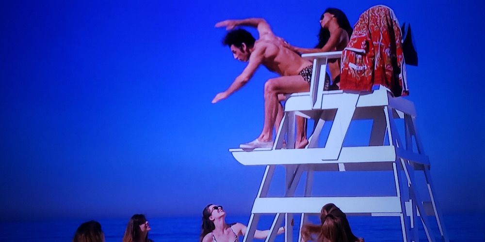 Kramer teaches girls at the beach how to dive