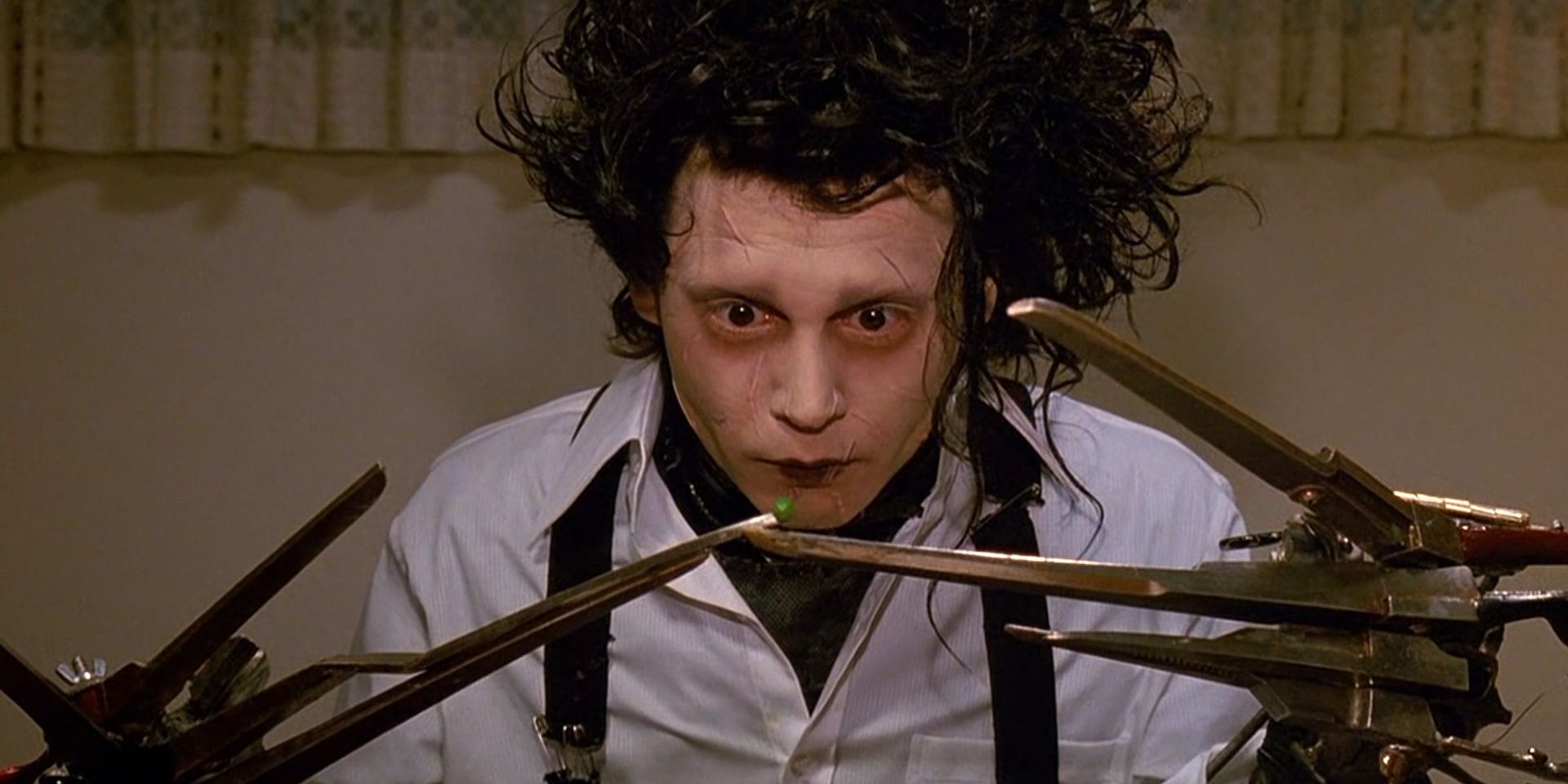 Johnny Depp as Edward Scissorhands trying to eat