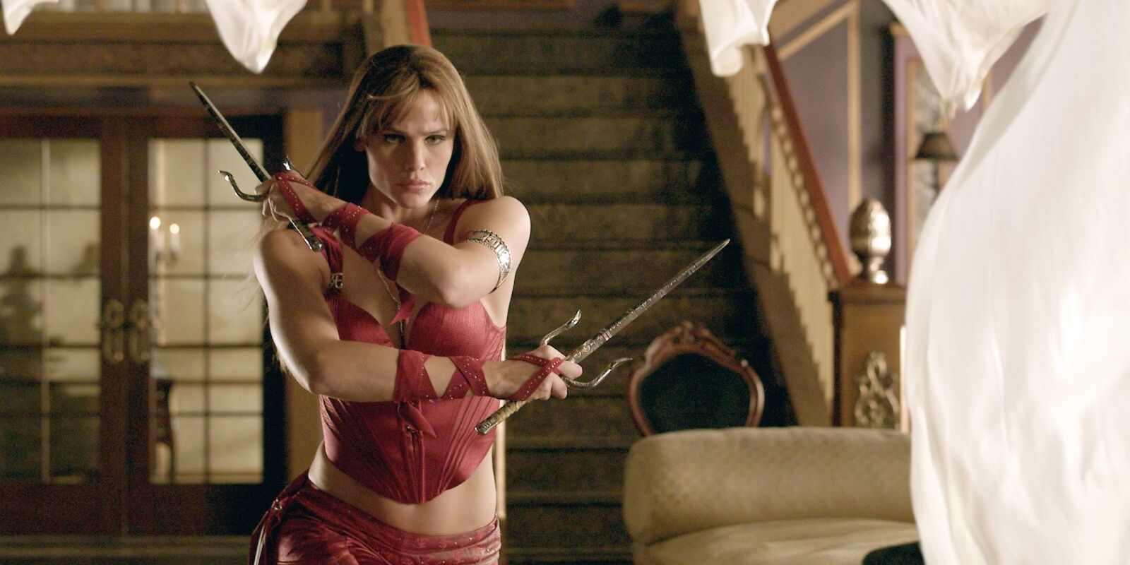 Jennifer Garner as Elektra wielding weapons