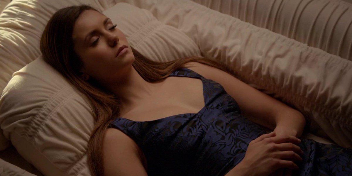 Elena in deep slumber in season 6 of The Vampire Diaries