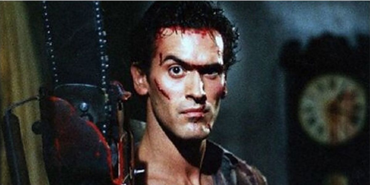 Ash Williams holds his chainsaw in Evil Dead II