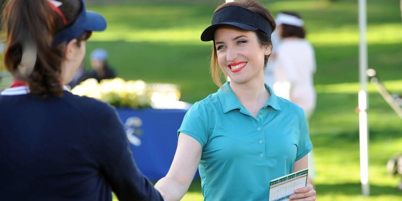 New Girl Jess and Fawn shake hands on the golf course