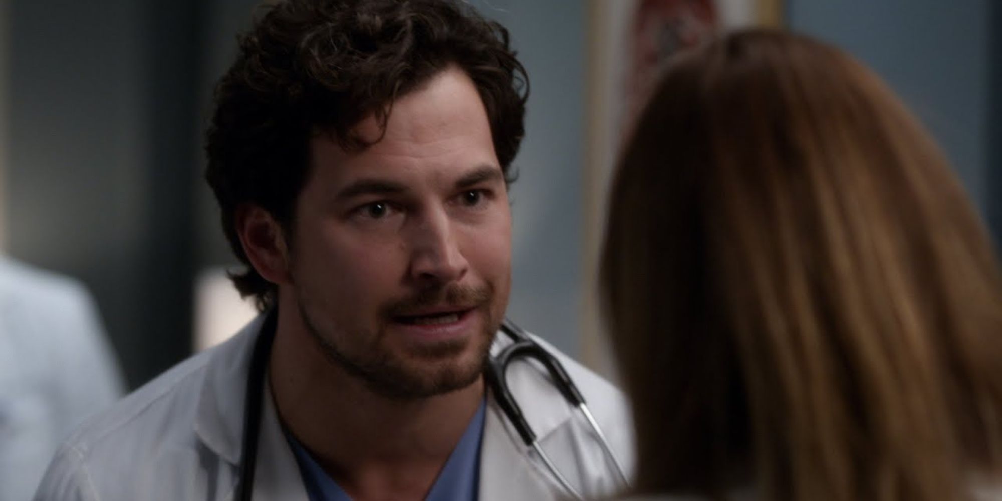 DeLuca argues with Meredith in the hospital corridors