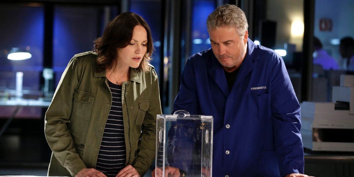 Grissom and Sara looking at evidence in CSI: Crime Scene Investigation