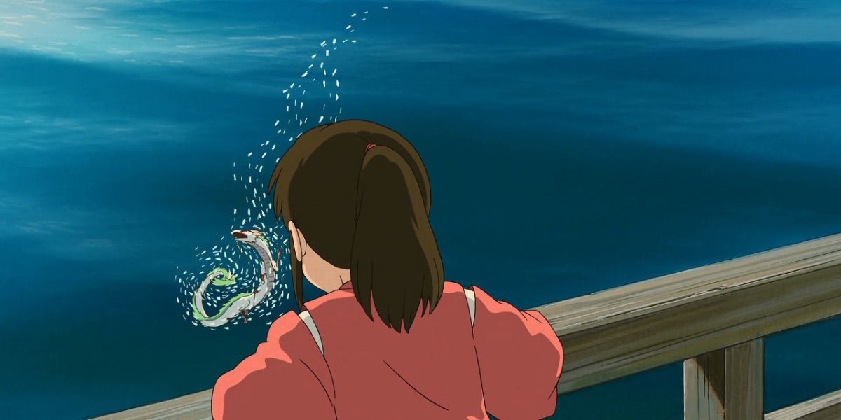 Chihiro watching as Haku in his dragon form is attacked in Spirited Away