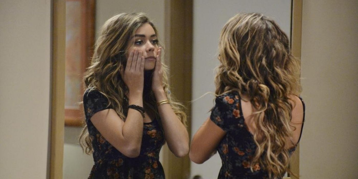 Haley looks at herself in the mirror on Modern Family